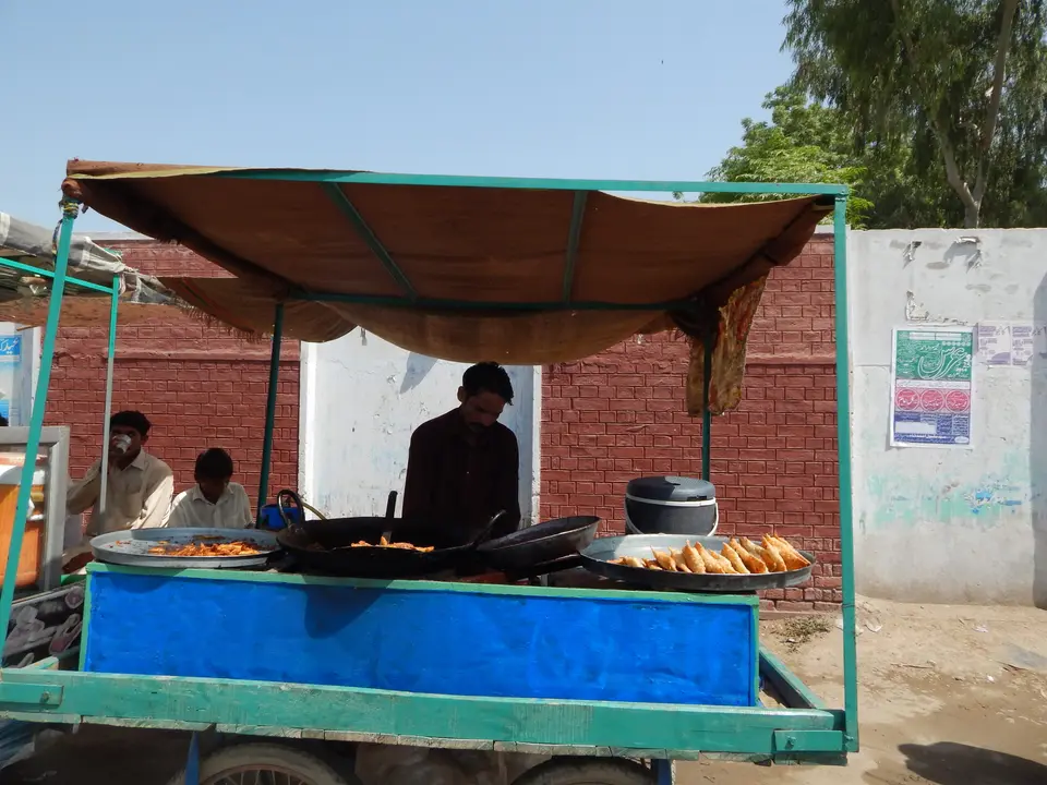 A food vendor at his cart