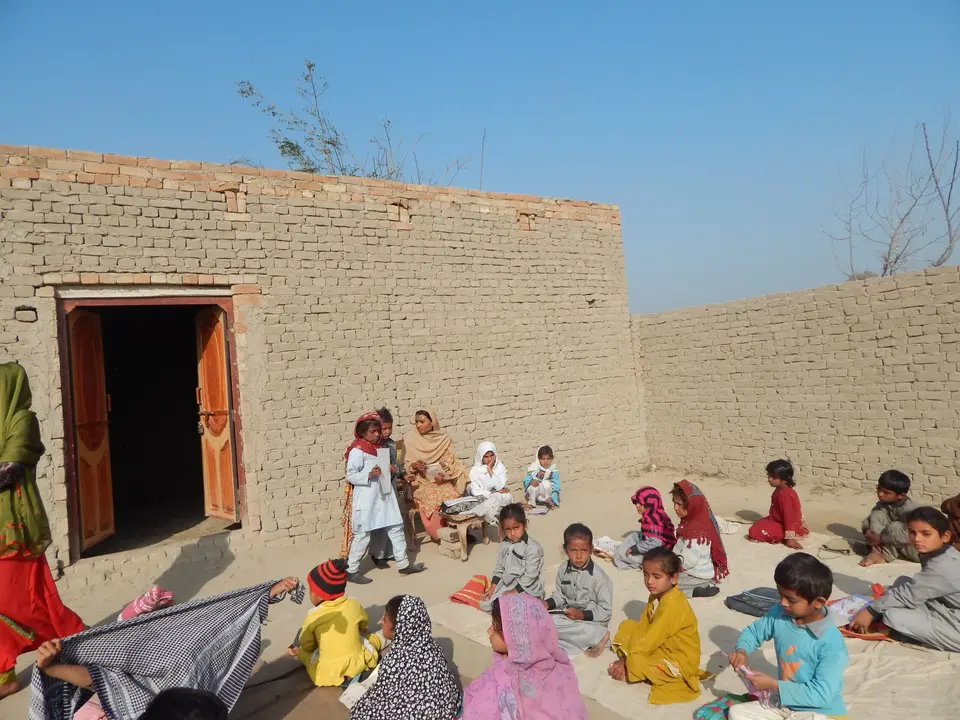 Village children learning in a courtyard